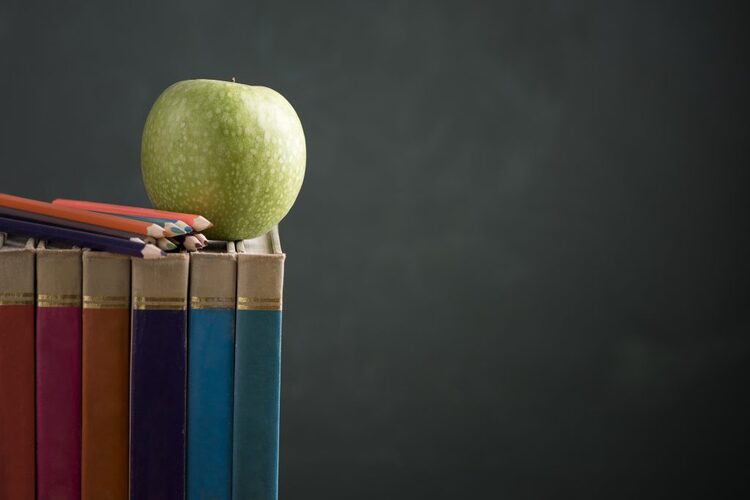 Book And Pencils On A Black Background 1024x683