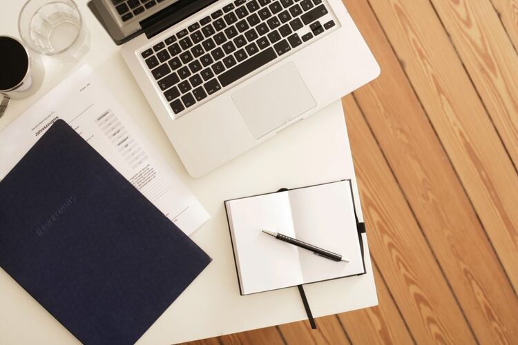 A Laptop And Pad On A Desk 1024x683